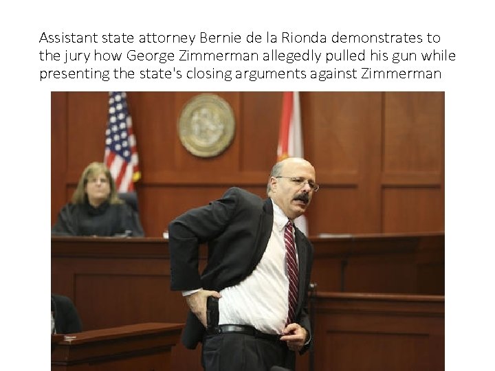 Assistant state attorney Bernie de la Rionda demonstrates to the jury how George Zimmerman