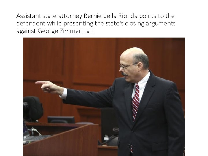Assistant state attorney Bernie de la Rionda points to the defendent while presenting the