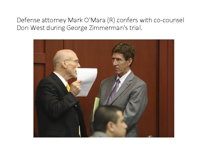 Defense attorney Mark O'Mara (R) confers with co-counsel Don West during George Zimmerman's trial.