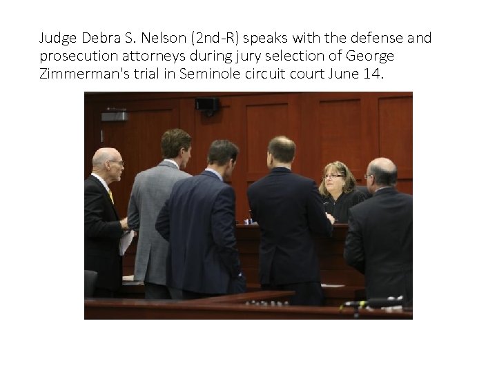 Judge Debra S. Nelson (2 nd-R) speaks with the defense and prosecution attorneys during