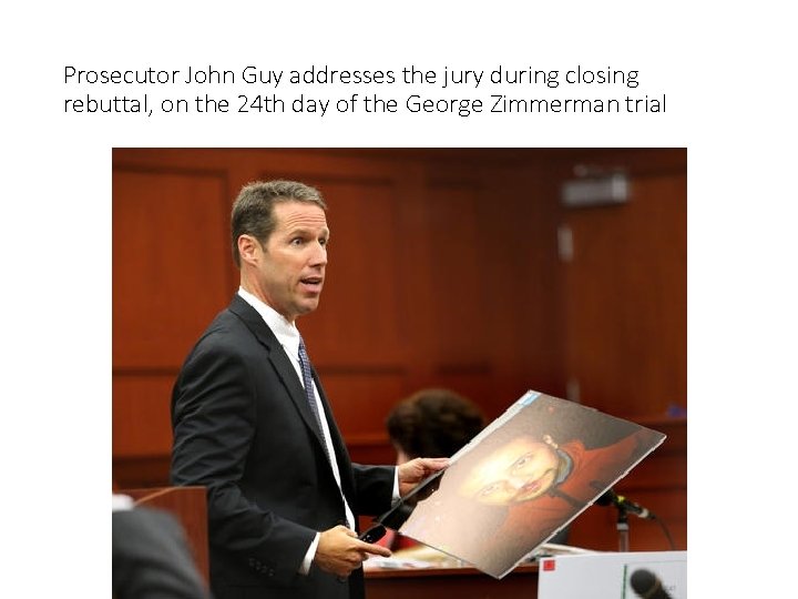 Prosecutor John Guy addresses the jury during closing rebuttal, on the 24 th day