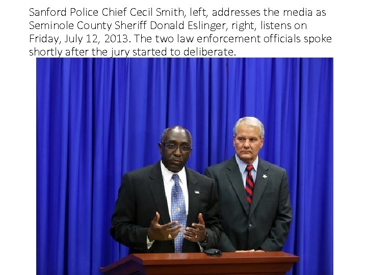 Sanford Police Chief Cecil Smith, left, addresses the media as Seminole County Sheriff Donald