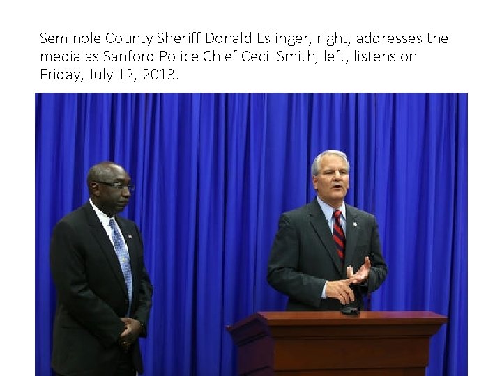 Seminole County Sheriff Donald Eslinger, right, addresses the media as Sanford Police Chief Cecil