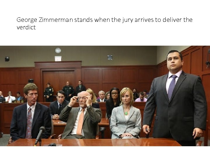 George Zimmerman stands when the jury arrives to deliver the verdict 