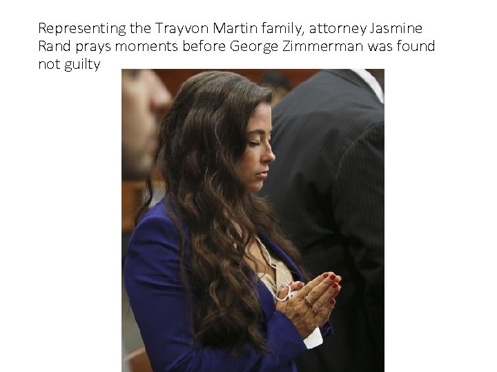 Representing the Trayvon Martin family, attorney Jasmine Rand prays moments before George Zimmerman was