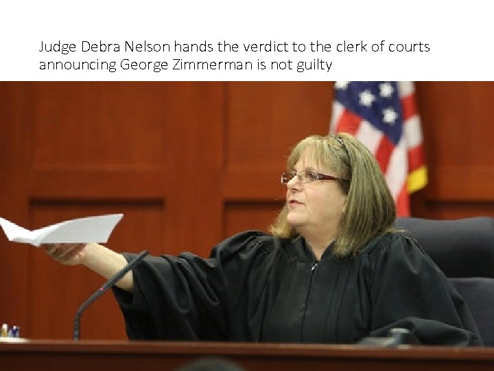 Judge Debra Nelson hands the verdict to the clerk of courts announcing George Zimmerman