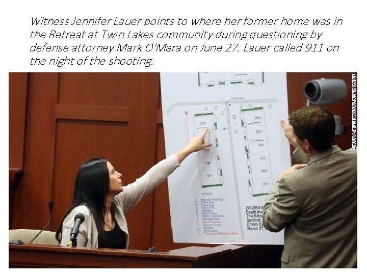 Witness Jennifer Lauer points to where her former home was in the Retreat at