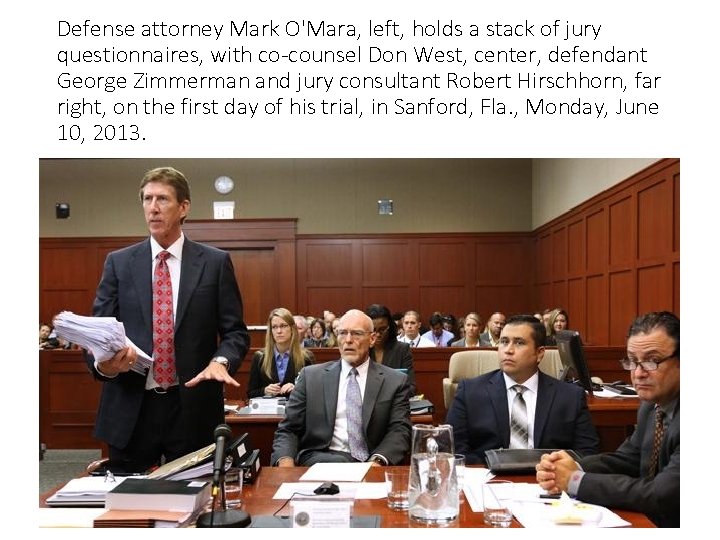 Defense attorney Mark O'Mara, left, holds a stack of jury questionnaires, with co-counsel Don