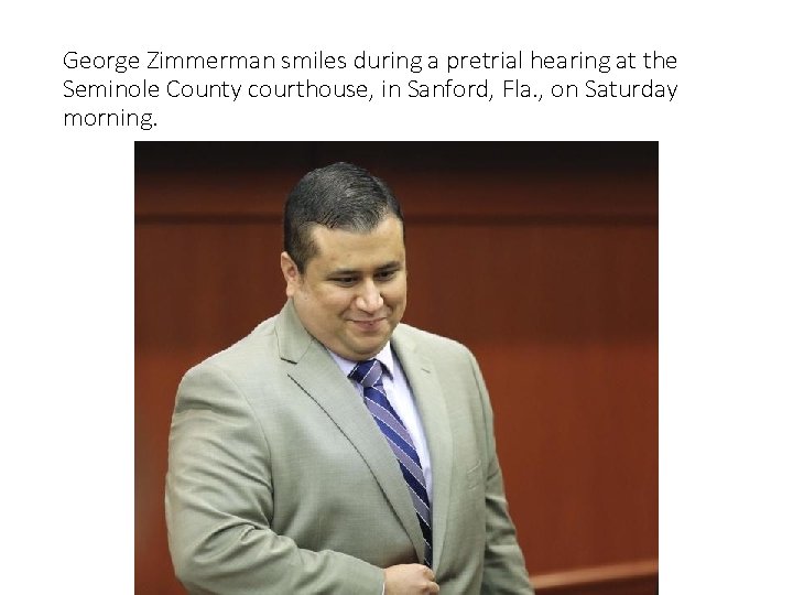 George Zimmerman smiles during a pretrial hearing at the Seminole County courthouse, in Sanford,