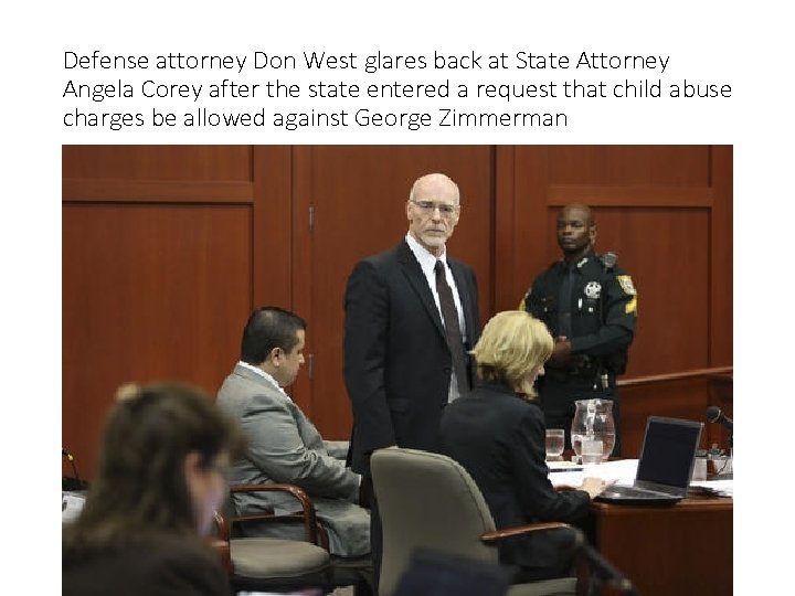 Defense attorney Don West glares back at State Attorney Angela Corey after the state