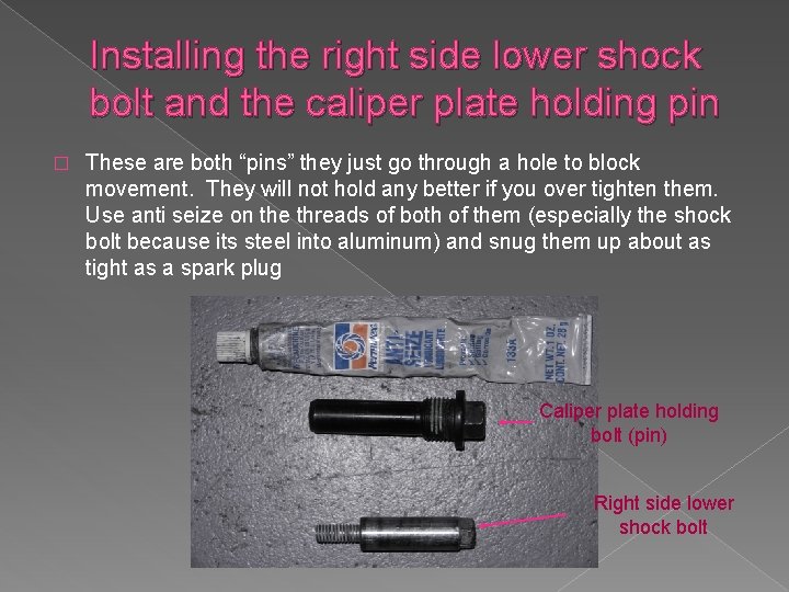 Installing the right side lower shock bolt and the caliper plate holding pin �