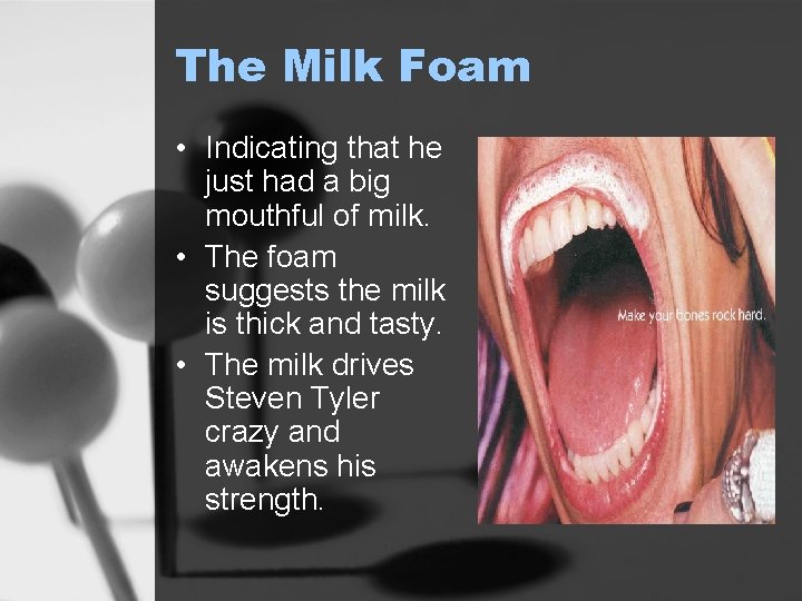 The Milk Foam • Indicating that he just had a big mouthful of milk.