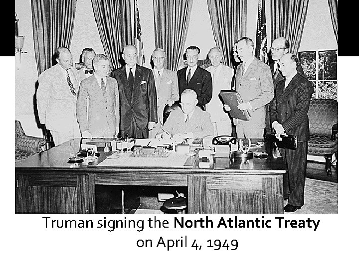 Truman signing the North Atlantic Treaty on April 4, 1949 