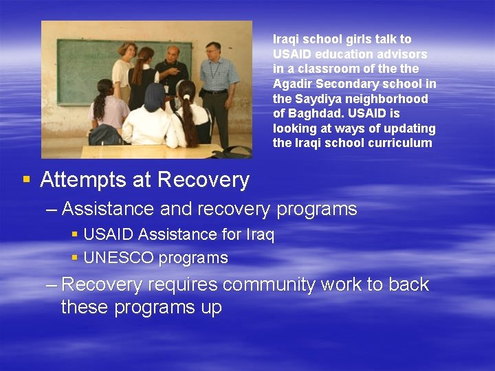 Iraqi school girls talk to USAID education advisors in a classroom of the Agadir