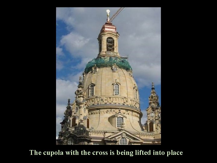 The cupola with the cross is being lifted into place 