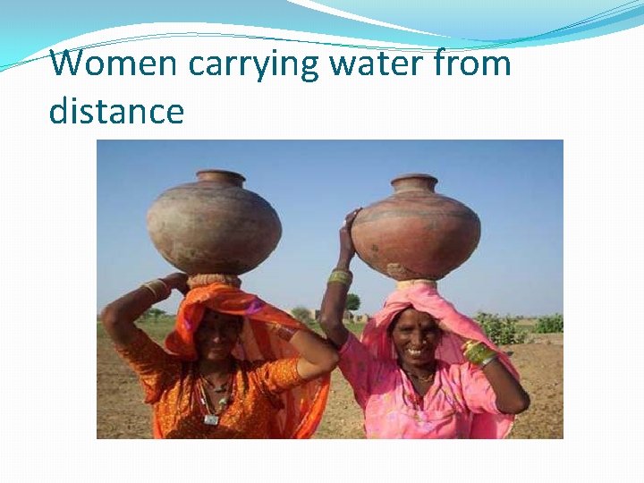 Women carrying water from distance 