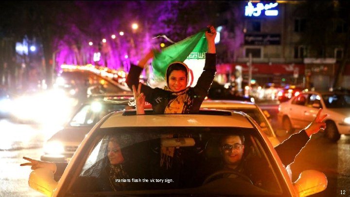 Iranians flash the victory sign. 12 