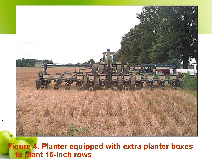 . Figure 4. Planter equipped with extra planter boxes to plant 15 -inch rows