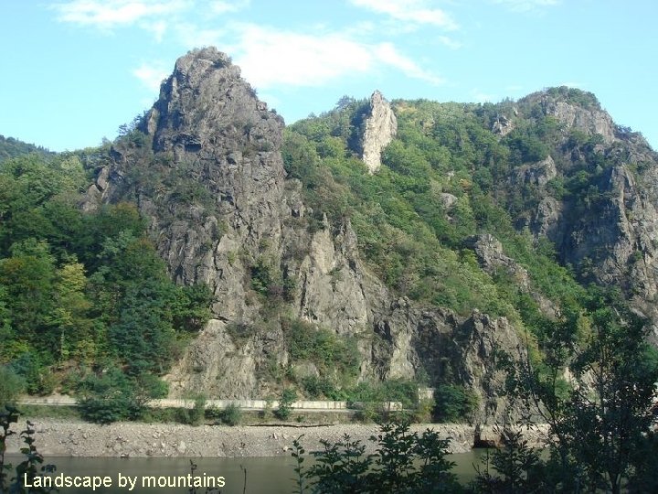 Landscape by mountains 