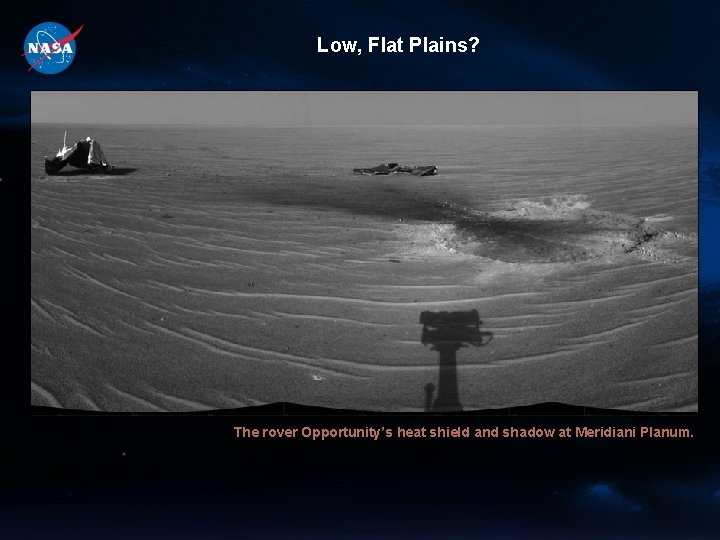 Low, Flat Plains? The rover Opportunity’s heat shield and shadow at Meridiani Planum. 