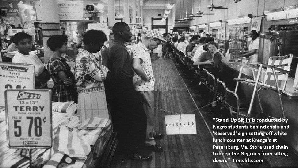 "Stand-Up Sit-In is conducted by Negro students behind chain and 'Reserved' sign setting off