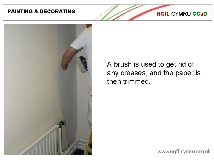 PAINTING & DECORATING NGf. L CYMRU GCa. D A brush is used to get