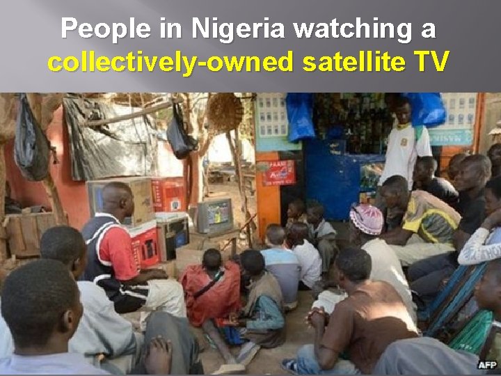 People in Nigeria watching a collectively-owned satellite TV 