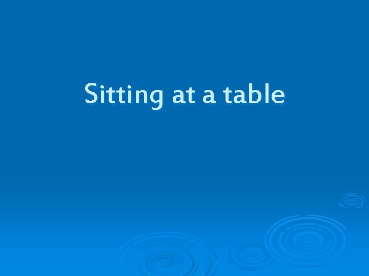 Sitting at a table 