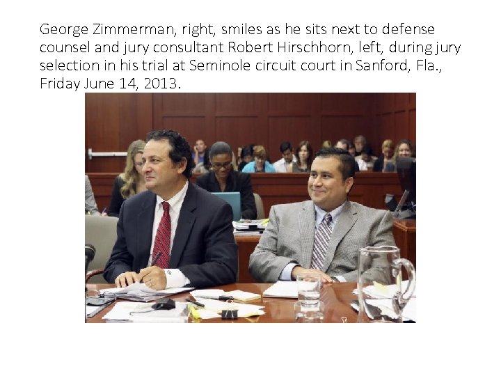 George Zimmerman, right, smiles as he sits next to defense counsel and jury consultant
