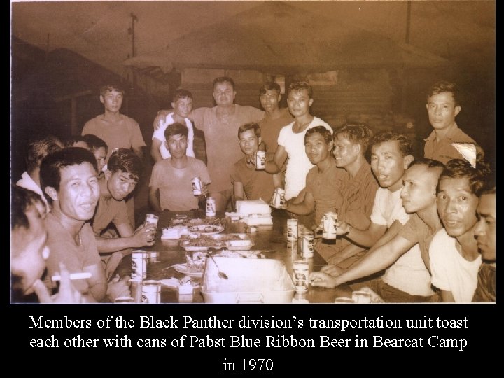 Members of the Black Panther division’s transportation unit toast each other with cans of