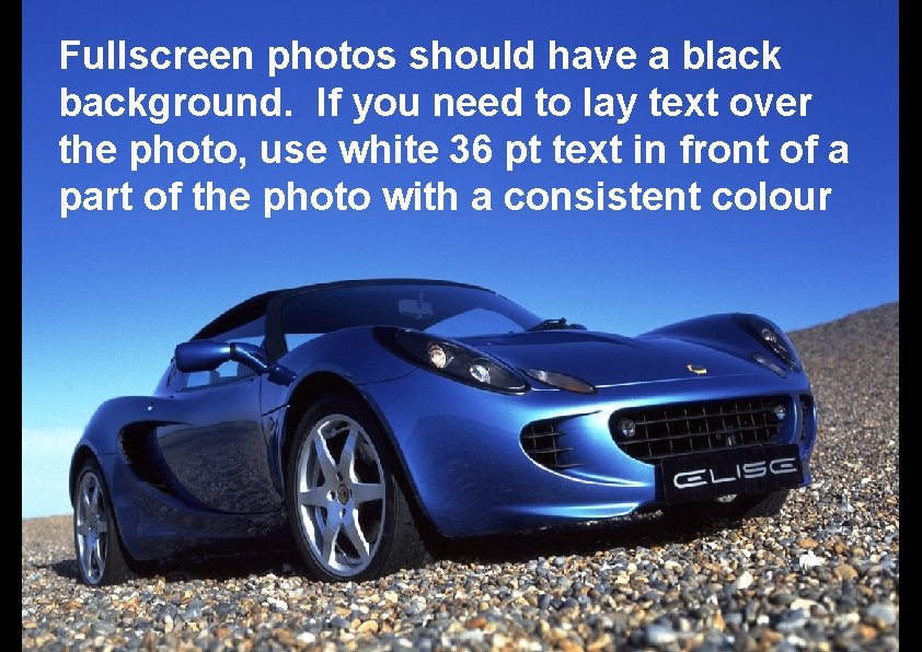 Fullscreen photos should have a black background. If you need to lay text over