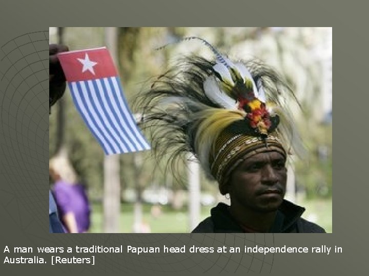 A man wears a traditional Papuan head dress at an independence rally in Australia.