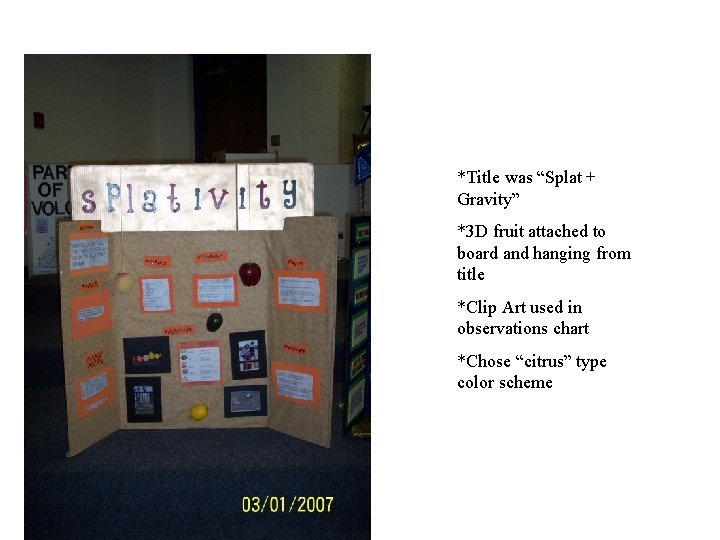 *Title was “Splat + Gravity” *3 D fruit attached to board and hanging from *Title was “Splat + Gravity” *3 D fruit attached to board and hanging from