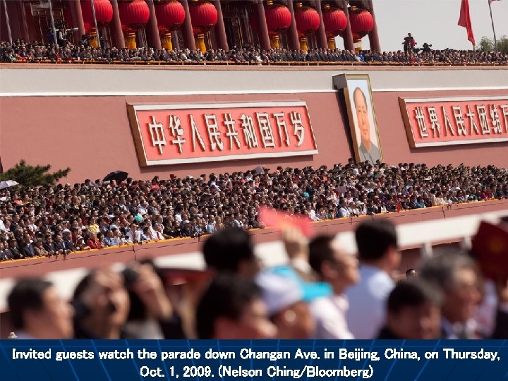 Invited guests watch the parade down Changan Ave. in Beijing, China, on Thursday, Oct.