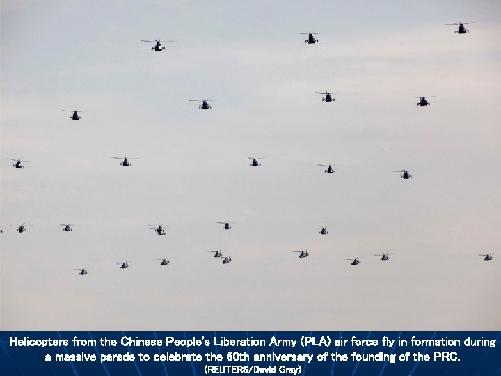 Helicopters from the Chinese People's Liberation Army (PLA) air force fly in formation during