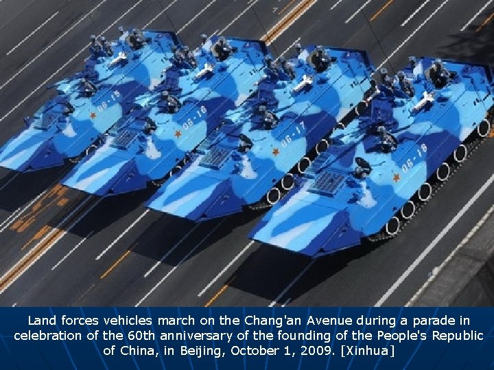 Land forces vehicles march on the Chang'an Avenue during a parade in celebration of
