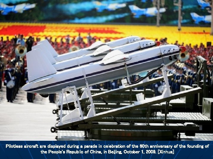 Pilotless aircraft are displayed during a parade in celebration of the 60 th anniversary