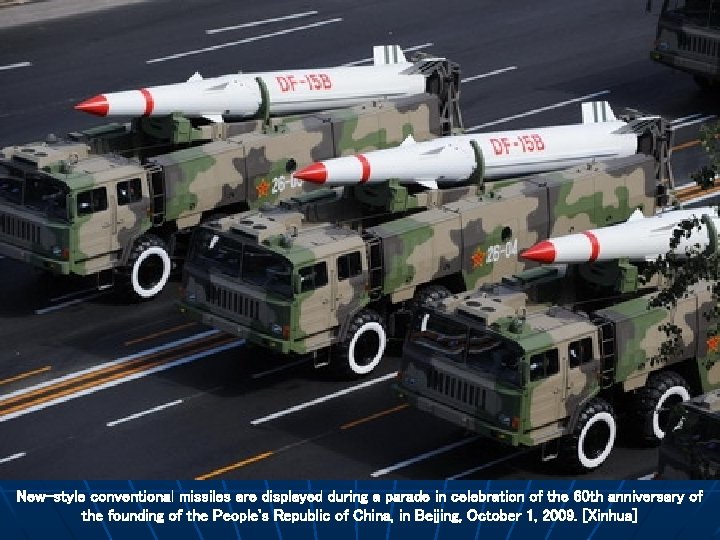 New-style conventional missiles are displayed during a parade in celebration of the 60 th