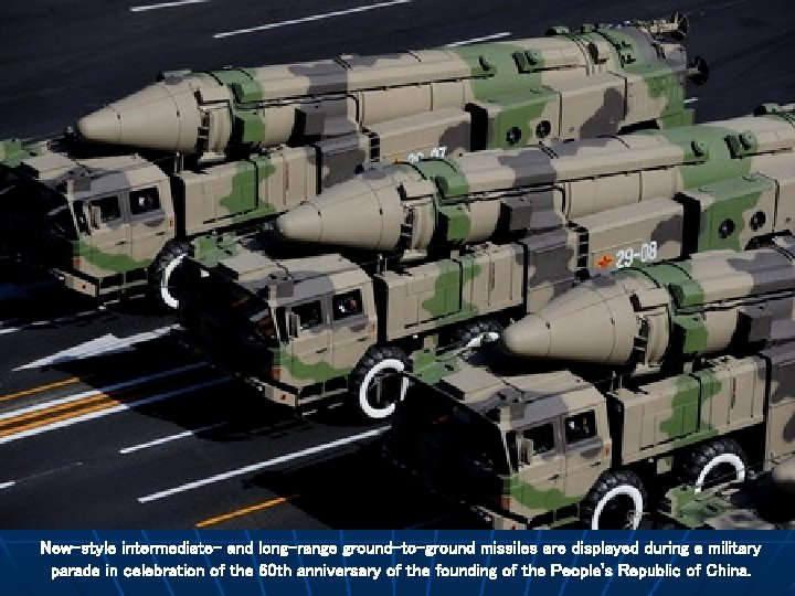 New-style intermediate- and long-range ground-to-ground missiles are displayed during a military parade in celebration