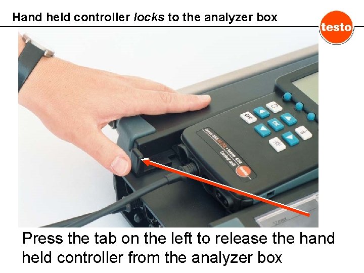 Hand held controller locks to the analyzer box Press the tab on the left
