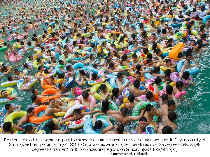 Residents crowd in a swimming pool to escape the summer heat during a hot Residents crowd in a swimming pool to escape the summer heat during a hot