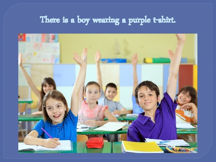 There is a boy wearing a purple t-shirt. 