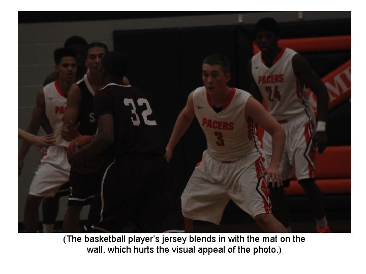 (The basketball player’s jersey blends in with the mat on the wall, which hurts