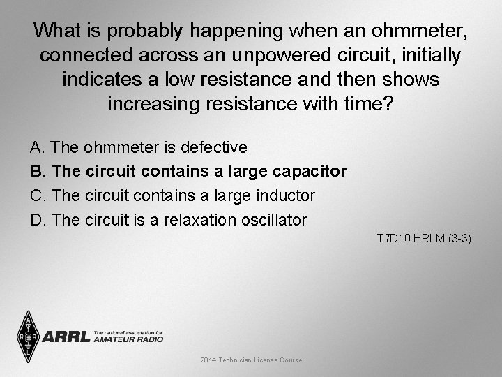 What is probably happening when an ohmmeter, connected across an unpowered circuit, initially indicates