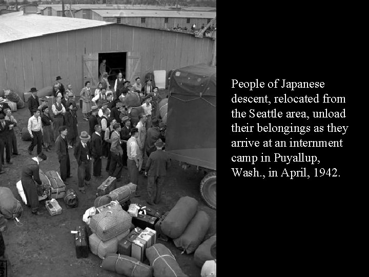 People of Japanese descent, relocated from the Seattle area, unload their belongings as they