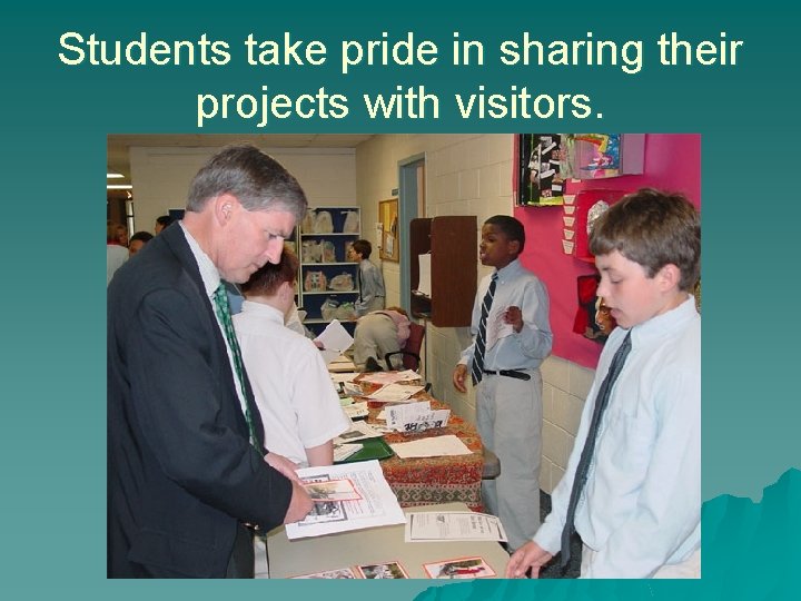 Students take pride in sharing their projects with visitors. 