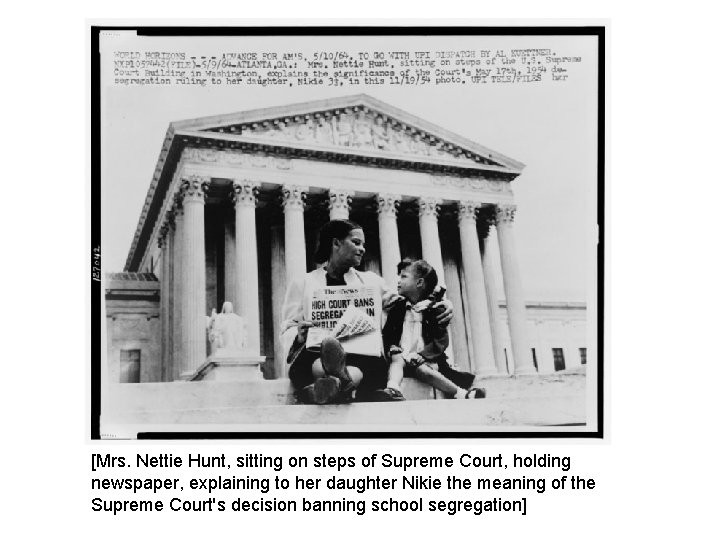 [Mrs. Nettie Hunt, sitting on steps of Supreme Court, holding newspaper, explaining to her