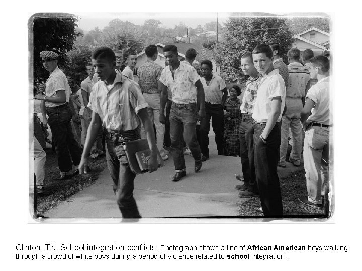 Clinton, TN. School integration conflicts. Photograph shows a line of African American boys walking