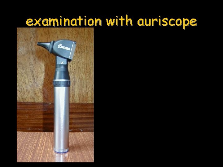 examination with auriscope 