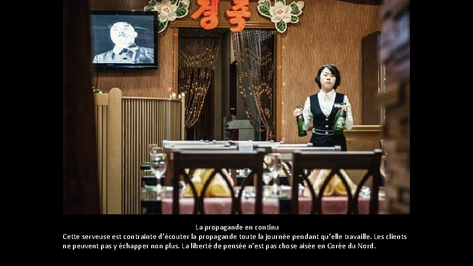 La propagande en continu Cette serveuse est contrainte d’écouter la propagande toute la La propagande en continu Cette serveuse est contrainte d’écouter la propagande toute la